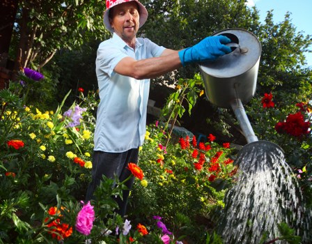 Landscapers completing outdoor works with safety checks